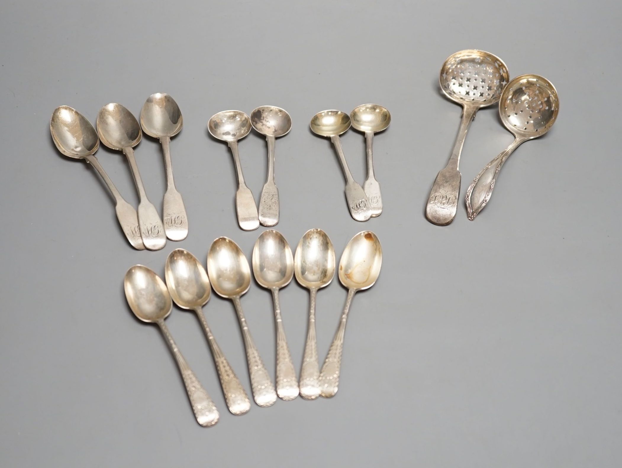 A quantity of silver teaspoons, sifter spoons and condiment spoons, including a set of six coffee spoons, London, 1899